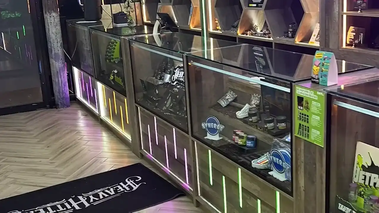 The Rezidue dispensary interior in Hell's Kitchen, Manhattan, lit in neon