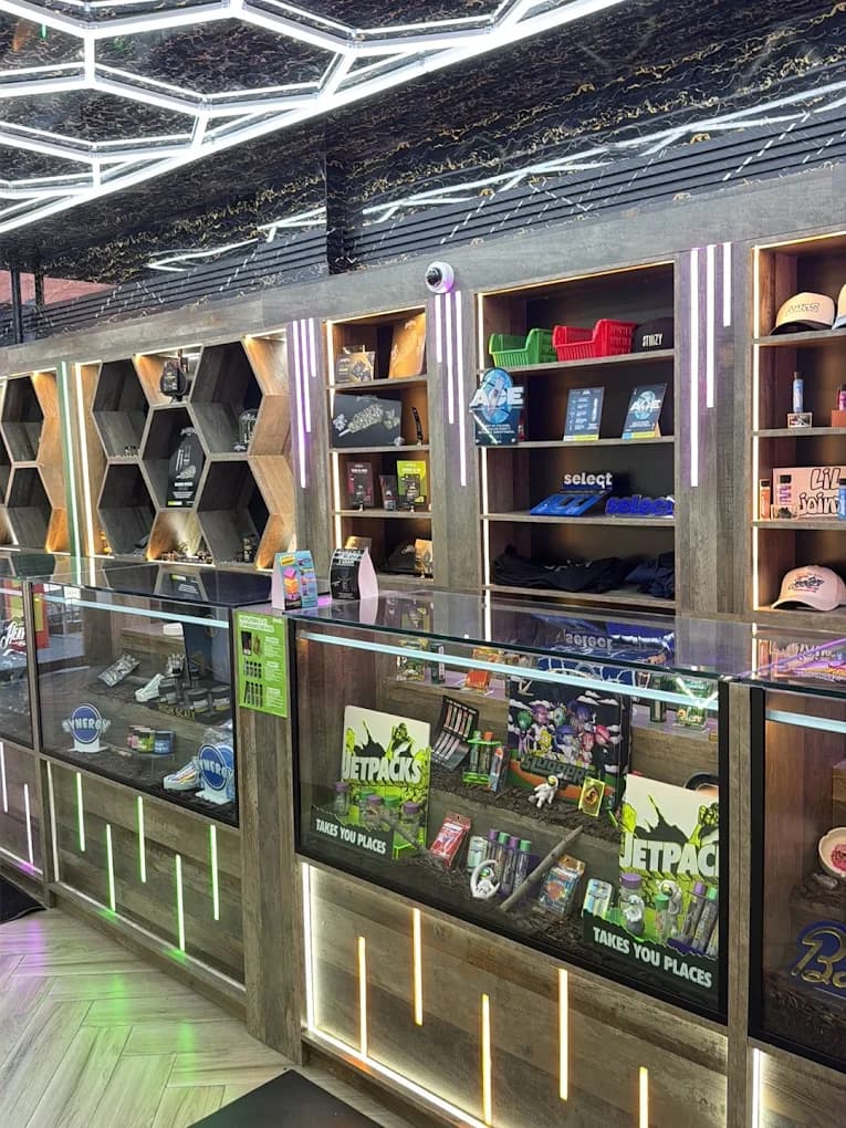 Honeycomb ceiling and backlit hexagon shelves inside Rezidue